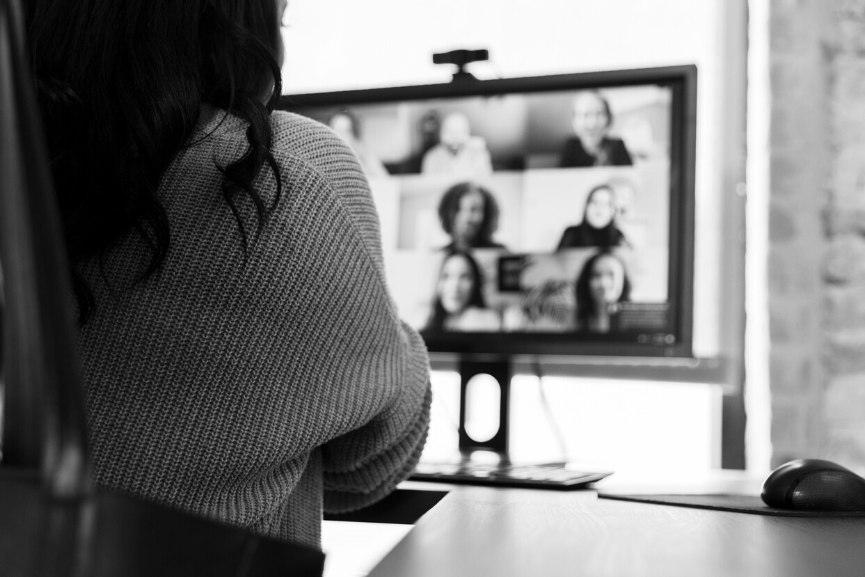 Unrecognizable businesswoman participating in virtual staff meeting